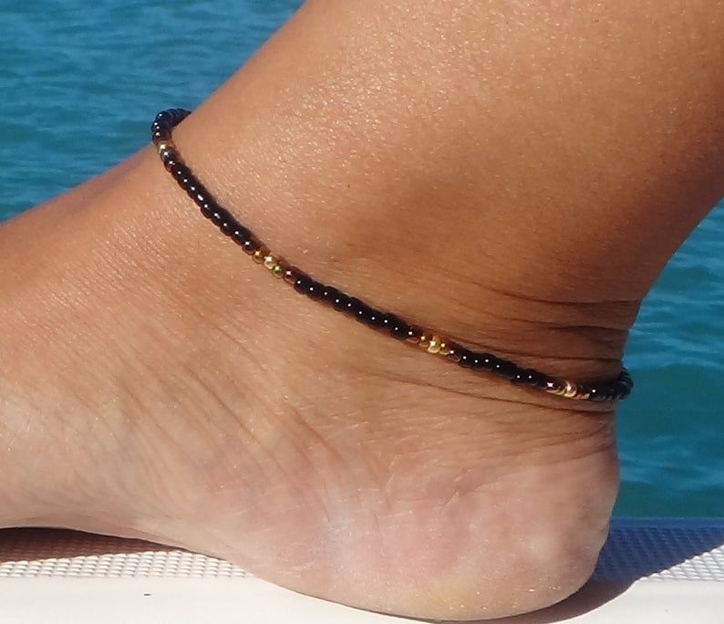 black and gold anklets